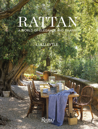 Cover of book depicting a rattan dining set among green trees