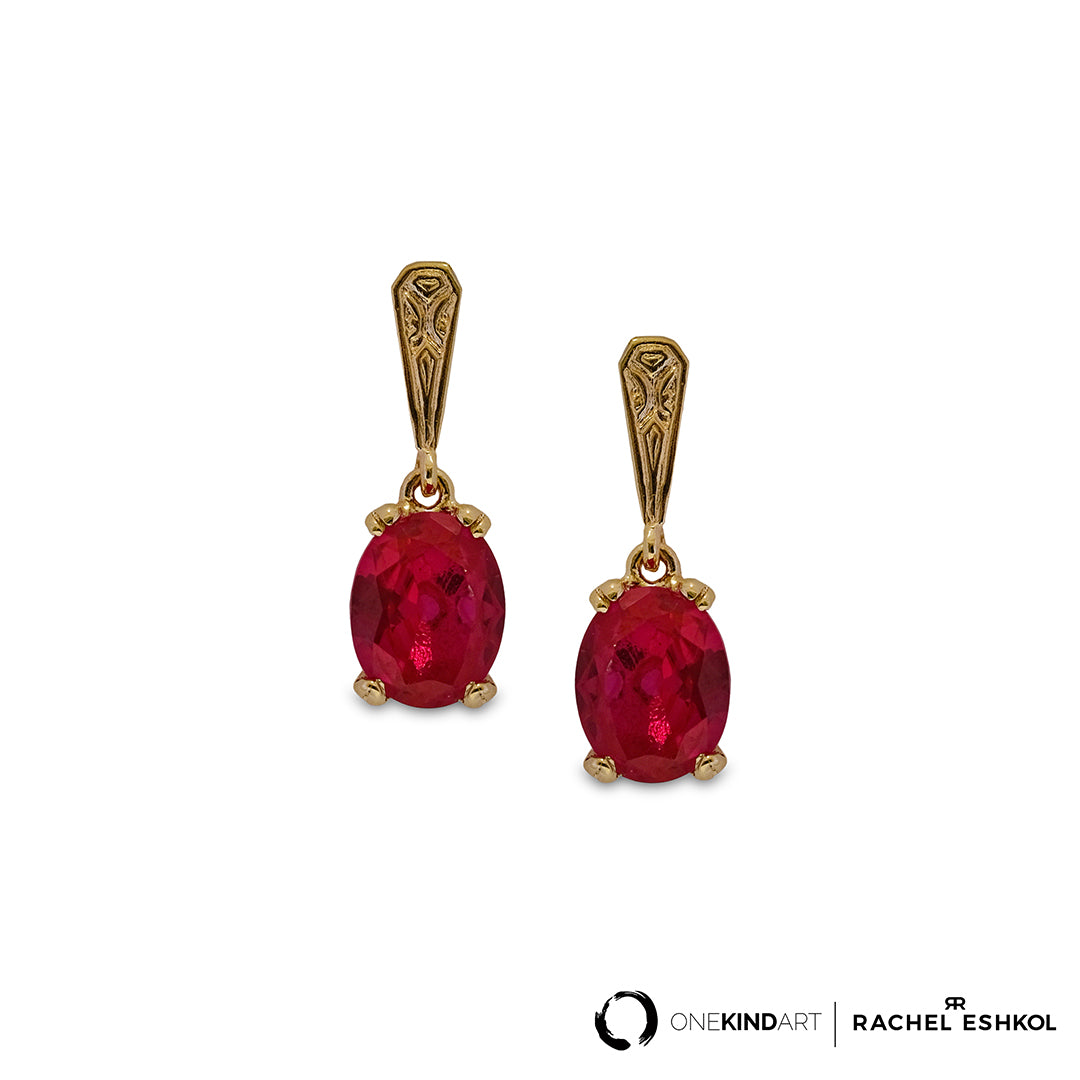 Photo of ruby replica earrings with gold design